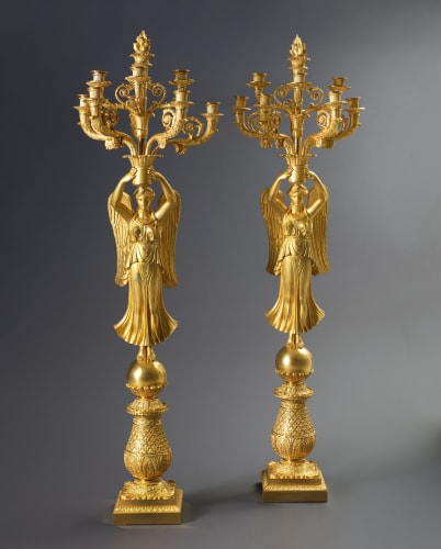 Thomire et Cie (attributed to), A pair of late Empire nine-light candelabra à la Victoire attributed to Thomire et Cie,...