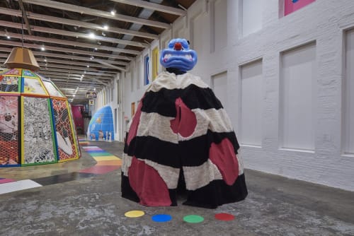 Trenton Doyle Hancock, Mound #1 and The Color Crop Experience (2019). Custom rug, stainless steel, and Color Crop video animation. © Trenton Doyle Hancock 2022. Photo: Tony Luong for MASS MoCA.
