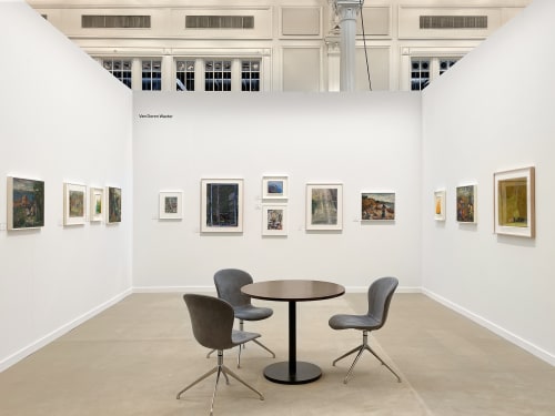 art fair booth with various framed artworks on the wall