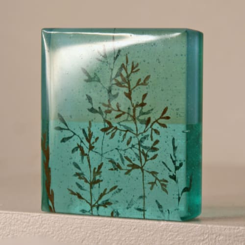 Helen Slater glass standalone sculpture, showing drawings of glass stems cast in light aqua and opaline glass