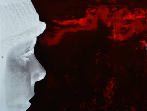 Simon J Harris oil on linen painting, a side close up portrait of a face staring into a black and red marbled background.