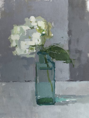 Sarah Spackman oil still life study of a small bunch of white hydrangea in a turquoise bottle vase, the tones of turquoise reflects on the steel grey surface.