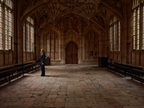 Joanna Vestley piece showing a figure looking out of the window of an Oxford building.