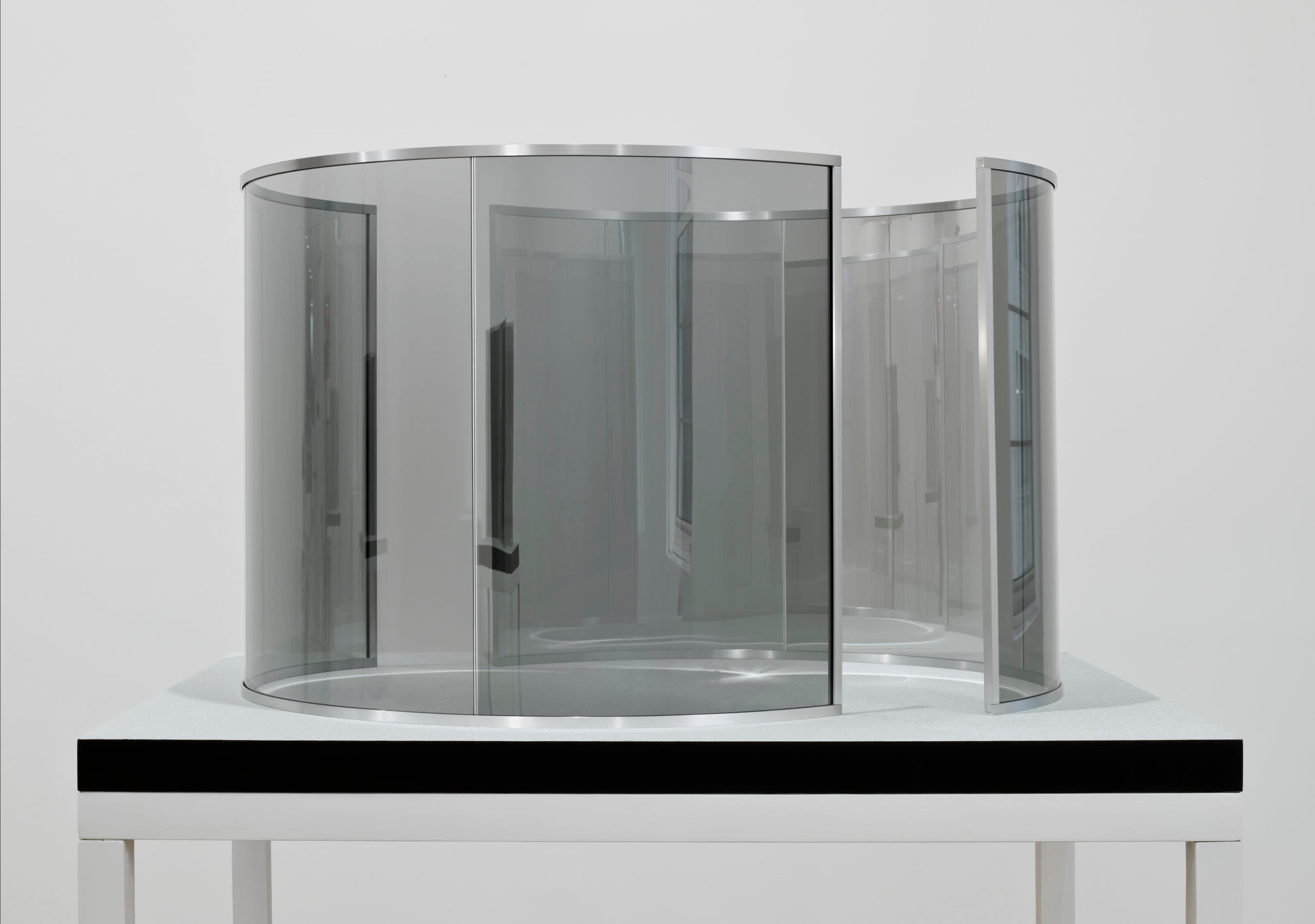 Dan Graham Two Half-Cylinders Off-Aligned, 2000 2-way mirror glass, aluminum, MDF, acrylic 27 1/2 x 42 1/8 x 49 1/4...