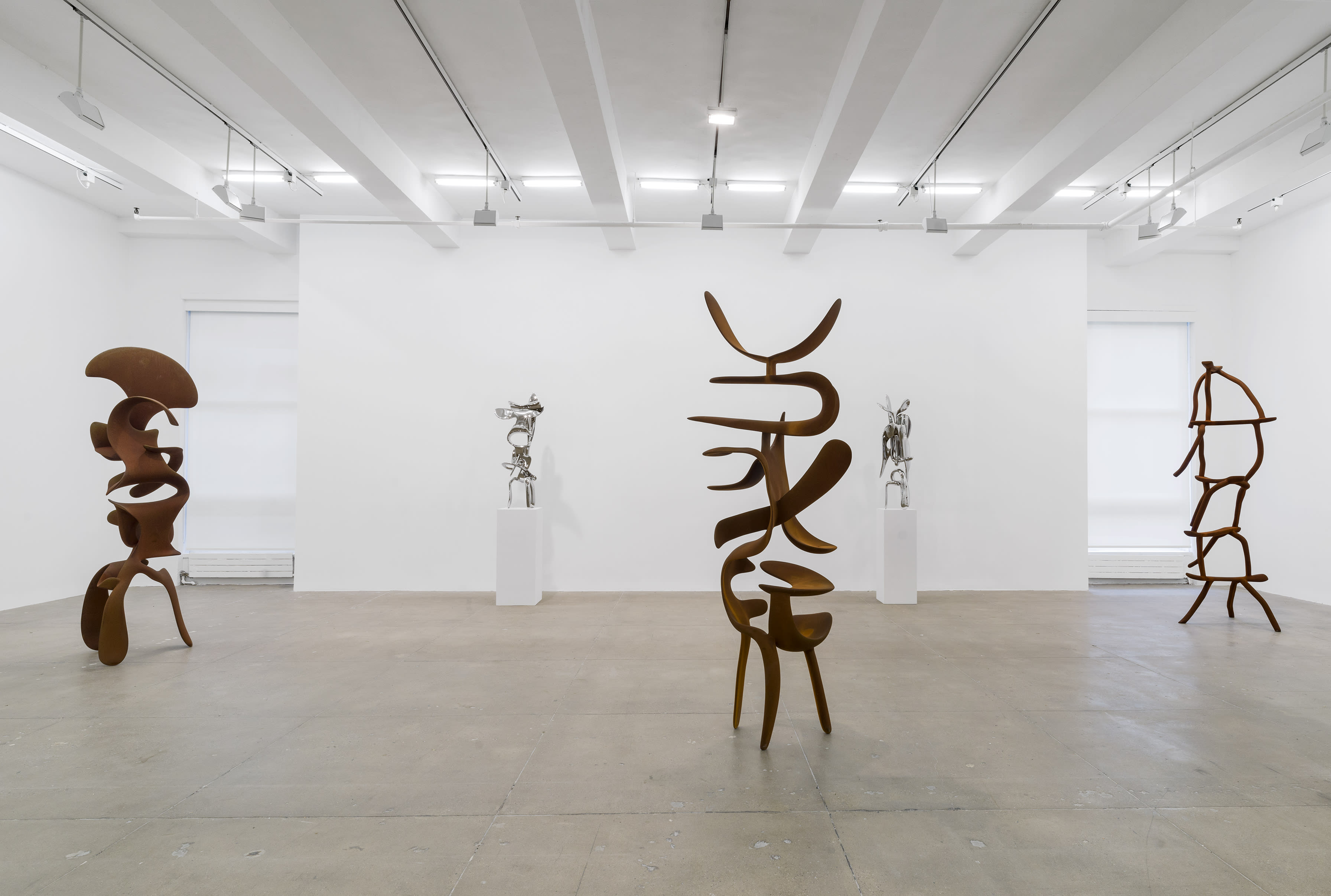 SOUTH GALLERY From left: the Incident series in corten steel and stainless steel, with Dreamsleeper