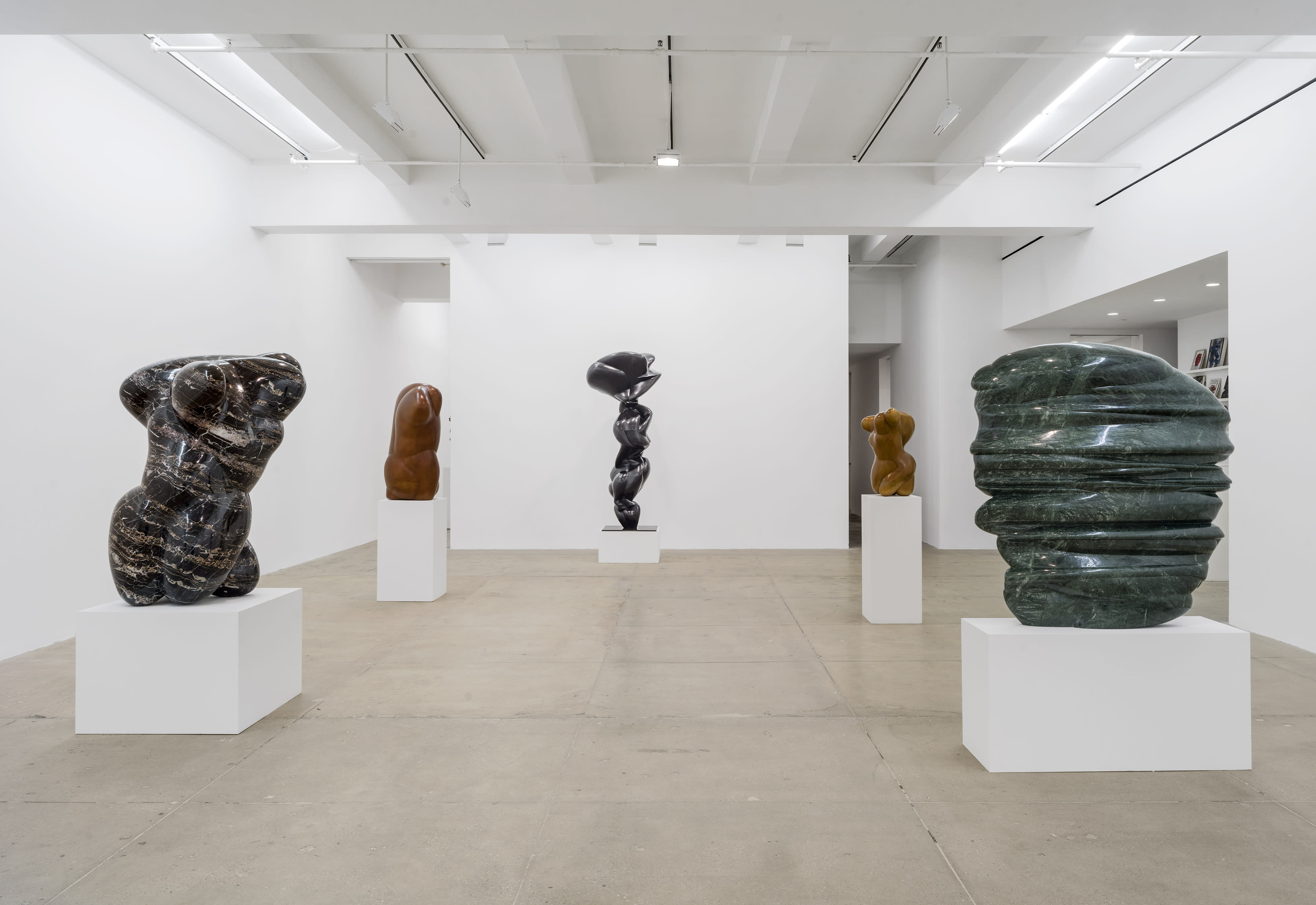 NORTH GALLERY Justine stands between three sculptures from the Integers series, and one from the Masks series