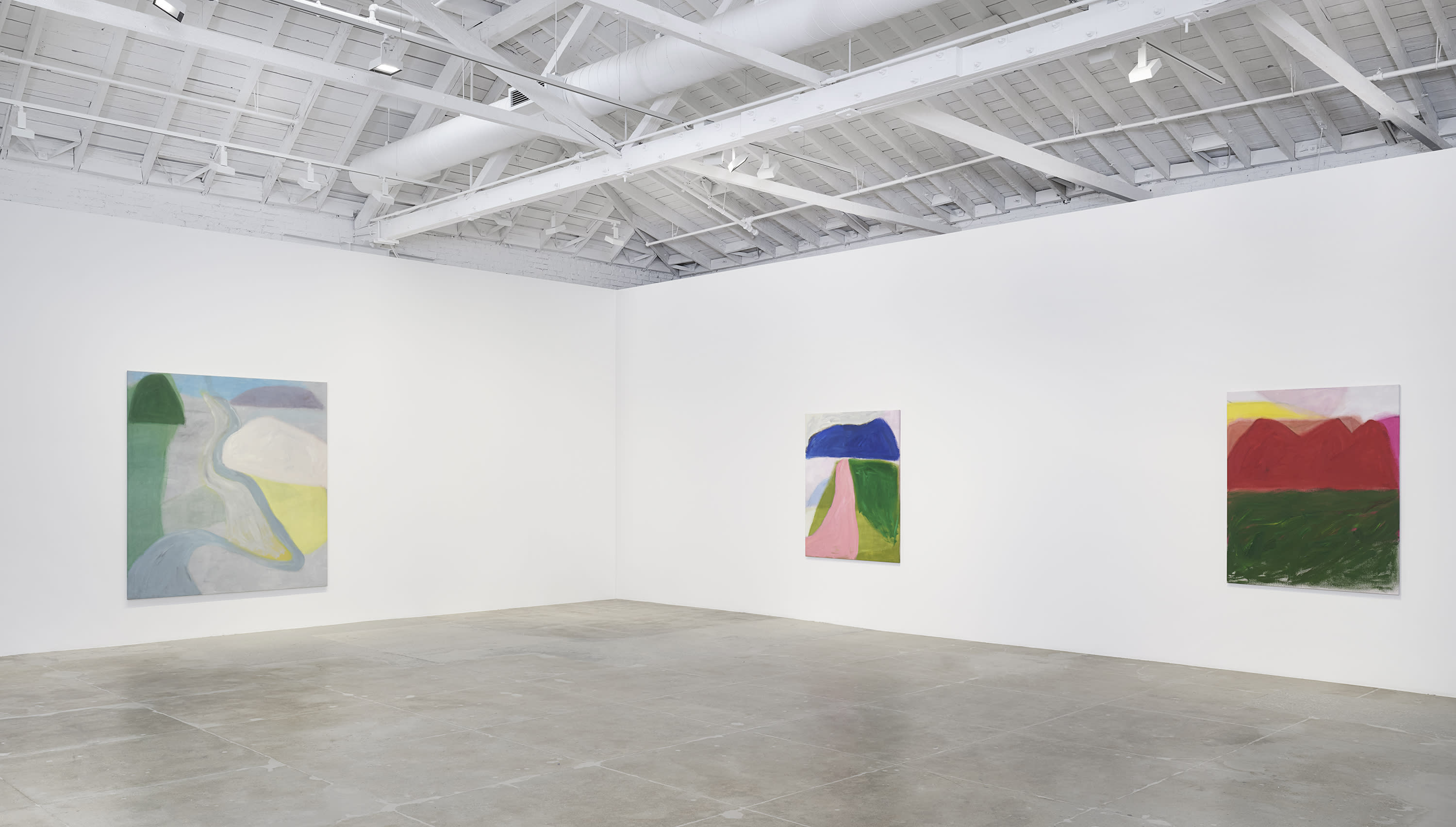 Three colorful landscape paintings by Jongsuk Yoon in white gallery space