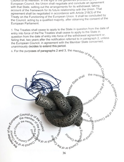 Jonathan Boyd Untying the Mess, 2019 Pendant Silver, silk and an altered copy of the Lisbon Treaty 30 x 20 x 6 cm