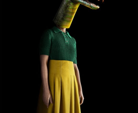 Contemporary surrealistic photography of a person wearing a dinosaur mask