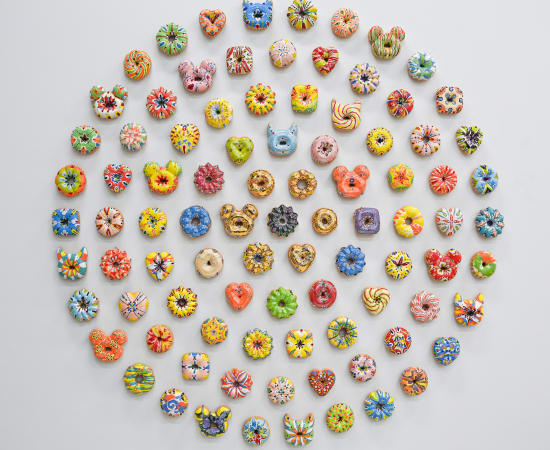 Individually made ceramic glazed donut wall sculptures with unique colors and shapes