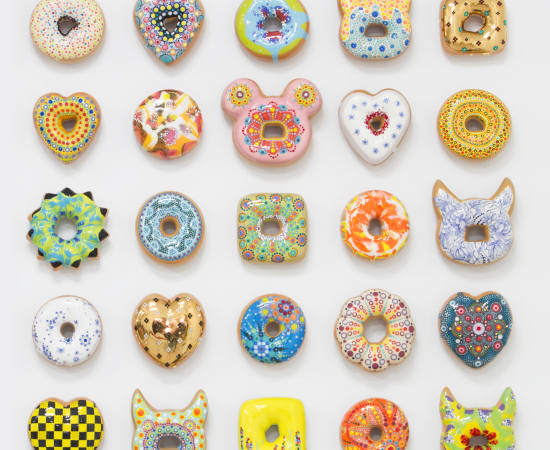 Individually hand glazed and painted cermaic donuts in unique colors and shapes