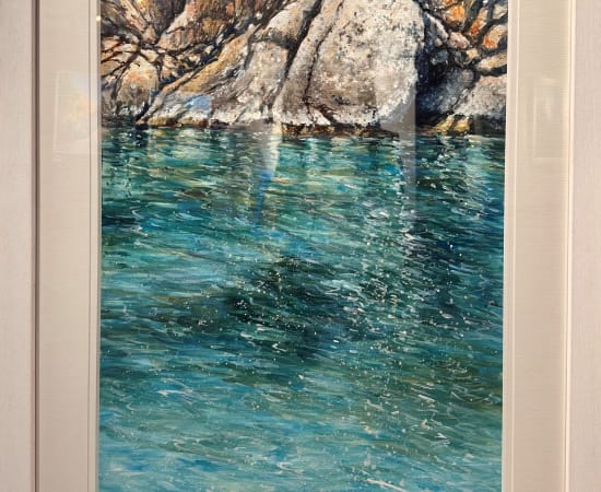 Crystal clear turquoise with rocks