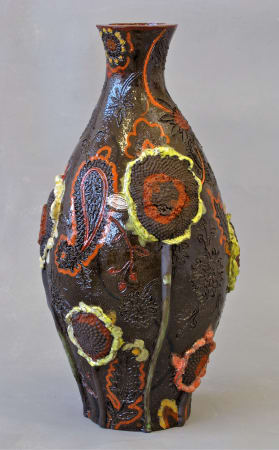 Ceramic vase with flowers by Fons van Laar available at the Rebecca Hossack Art Gallery.