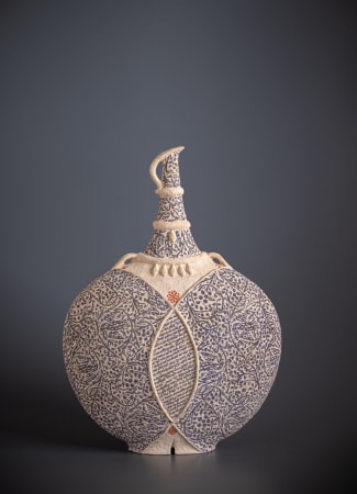 Ceramic vessel by ceramist Avital Sheffer, from Israel and New South Wales, Australia. Hand built stencilled earthenware, a round vessel in neutral color with blue details. Contemporary artwork with middle eastern influence.