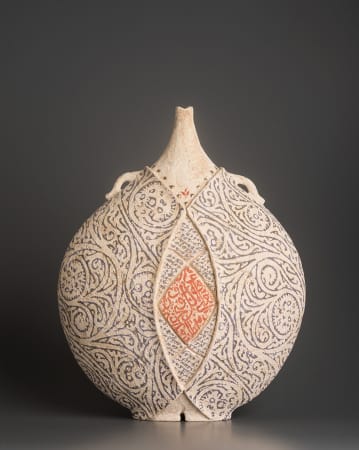 Ceramist Avital Sheffer, from Israel and New South Wales, Australia. Hand built earthenware vessel, with stencilled red and blue pattern. Contemporary sculptural artwork with middle eastern influence. 