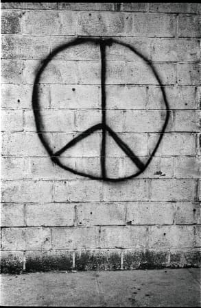 Jim Marshall, Peace sign on brick wall