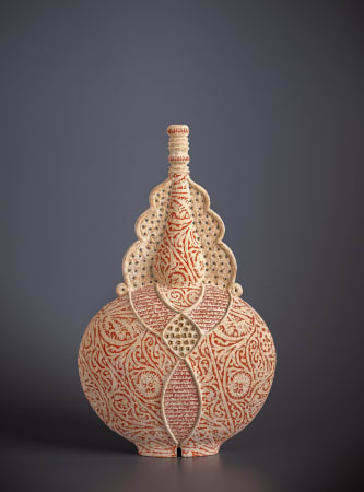 Hand built stencilled ceramic artwork by ceramist Avital Sheffer, from Israel and New South Wales, Australia. Earthenware pointed vessel with red pattern and middle eastern influence. Contemporary sculptural artwork.
