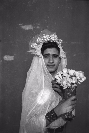 Akram Zaatari, Footnotes to Studio Practices. Najm posing with wedding dress. Photo by Hashem el Madani, Studio Shehrazade, Saida, 1950s, 2015