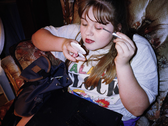 Megin putting on make-up, 1996