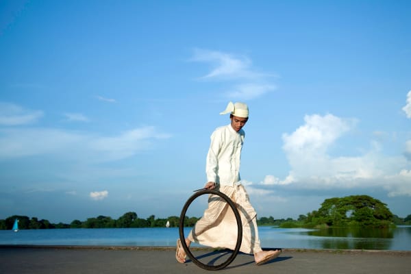 Moe Satt, Bicycle Tire Rolling Event from Yangon: Bank of Innya Lake, 2013