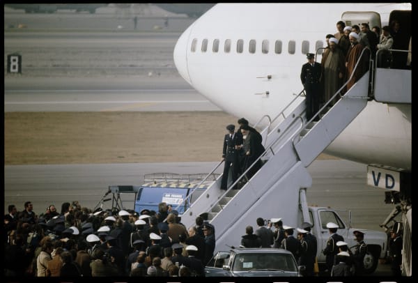 David Burnett, Ayatollah Khomeini disembarks from a chartered Air France 747 jet at Mehrabad Airport. Tehran, February 1, 1979