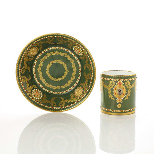 Sèvres Porcelain, A Soft-Paste Sèvres Porcelain 'jewelled' Cup & Saucer with Green Ground, 1781
