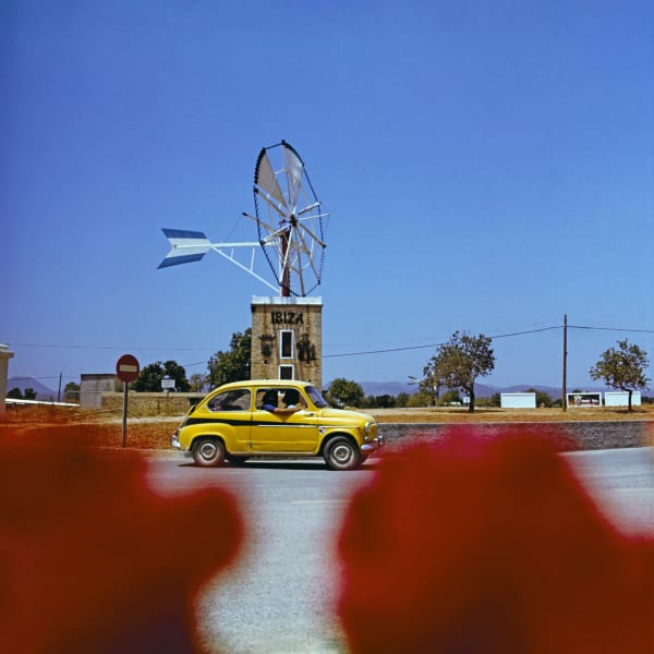 Walter Rudolph, Yellow Fiat 600 on a roundabout, Ibiza, Spain, 1976