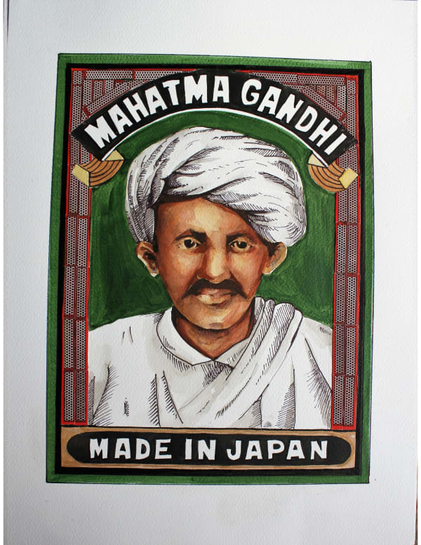 A matchbox cover depicting the portrait of a turbanded MK Gandhi against a green background with the words 'MAHATMA GANDHI' and 'MADE IN JAPAN' written above and below it. The portrait is seen encased in a frame of gunpowder strips found at the sides of a matchbox.