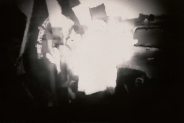 Rahul Juneja Dissection of a Temporal Spectre - Site 1, 2021-23 48 Pinhole negatives on FOMASPEED VAR 312, TV screen with the original video playing on and off, with vinyl text Variable Edition 1