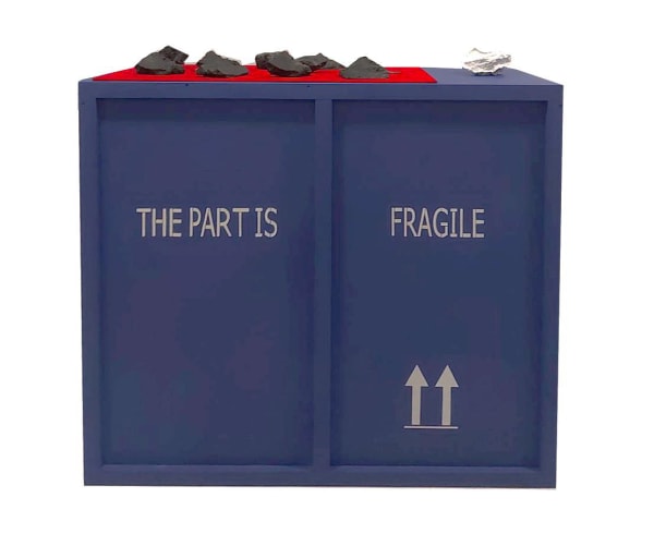 Black bricks on blue crate