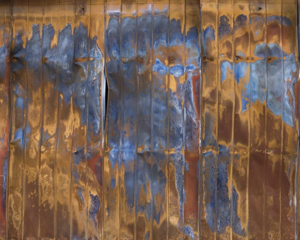 Gideon Mendel, Burnt cliplock iron sheeting wall. Sarsfield, Victoria, 2020