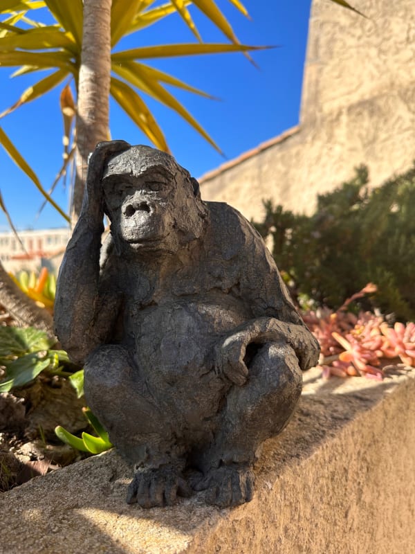 Gorilla sculpture by Bast in a contemplative Thinker-like posture, contemporary animal bronze artwork with refined black patina, collectible figurative sculpture