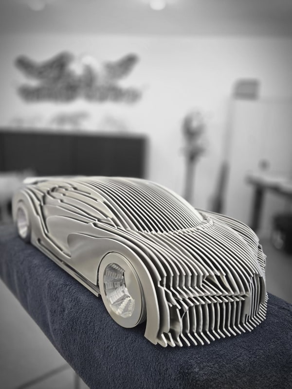 Chirona silver luxury racing car sculpture Jean Paul Kala contemporary car sculpture Art Yi gallery Brussels art gallery