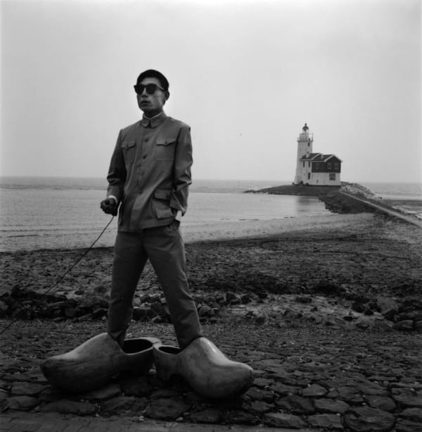 Tseng Kwong Chi, Lighthouse, Holland (Giant Clogs), 1986