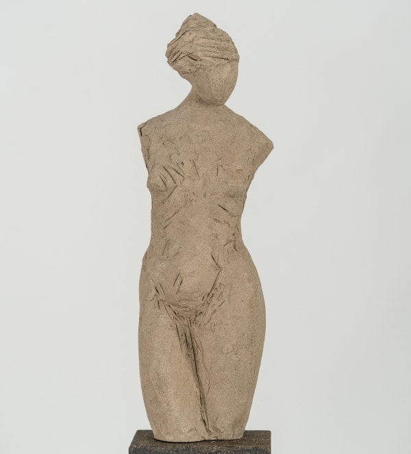 Fragmented figurative female torso in gray clay by sculptor Emilio DiIorio.