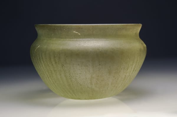 A Molded Green Glass Wine Bow, Greek, Hellenistic 300 B.C.E. – 200 B.C.E.