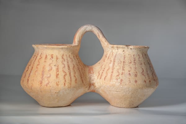 A Large Double Pottery Jar with A Basket Handle, Canaanite, Early Bronze Age, circa 3100 B.C.E.