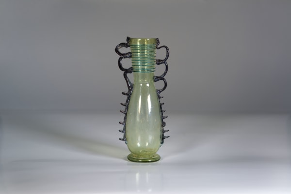 A Graceful Two Tone Green Glass Amphoriskos, Roman period, Circa 300 C.E. – 400 C.E.