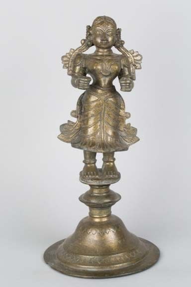 Indian bronze candle holder in the form of a female