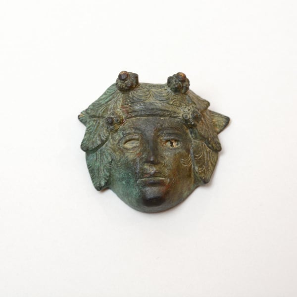 Roman Bronze Applique of the Head of Bacchus with Inlaid Glass Eye