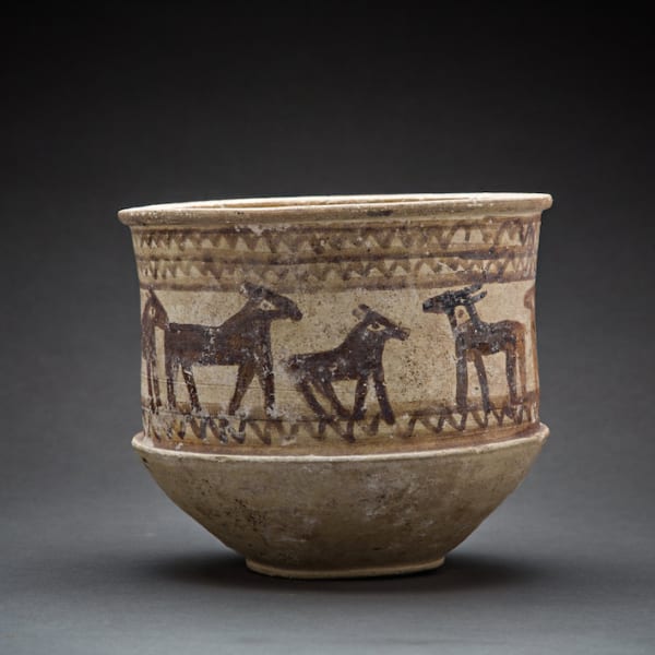 Luristan cylindrical pottery bowl painted with a frieze of animals
