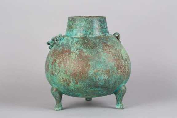 Bronze spherical cauldron on three legs