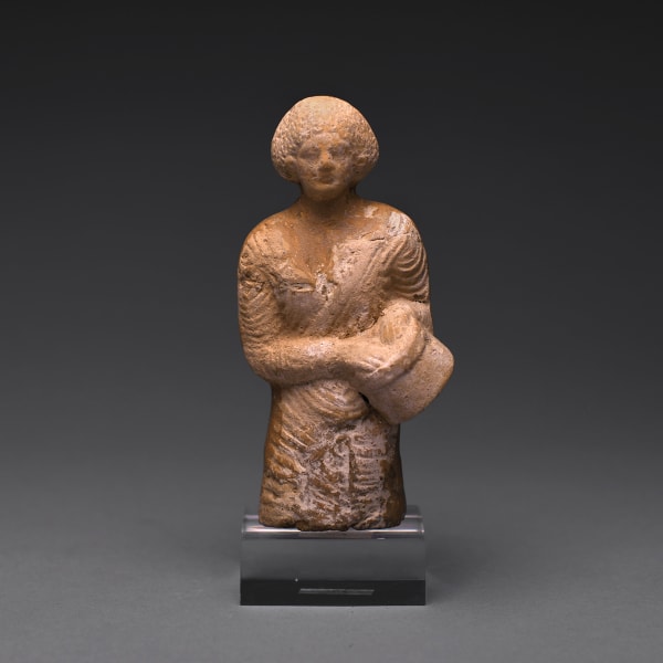 A Hellenistic Terracotta Statue of a Drummer