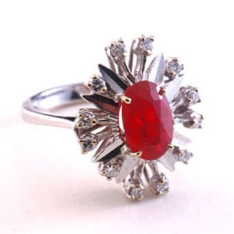 White Gold Ring Featuring a Ruby Surrounded by Twelve Diamonds