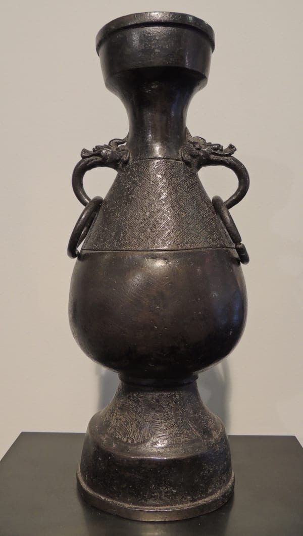 Chinese bronze urn type vase with guardian dragons ring handles