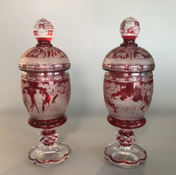 Pair of Bohemian etched red vases with hunting scene of stags