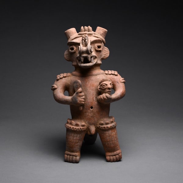 Sculpture of a Standing Saurian Deity Holding a Club and a Head
