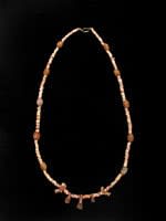 Limestone Bead Necklace With Amulets