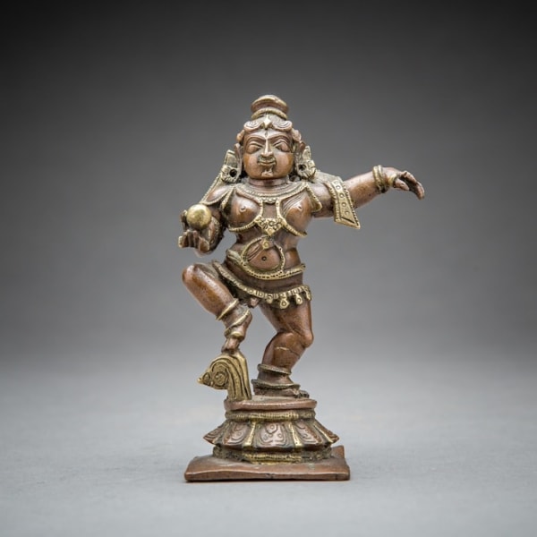 Dancing Krishna, holding a Butter Ball