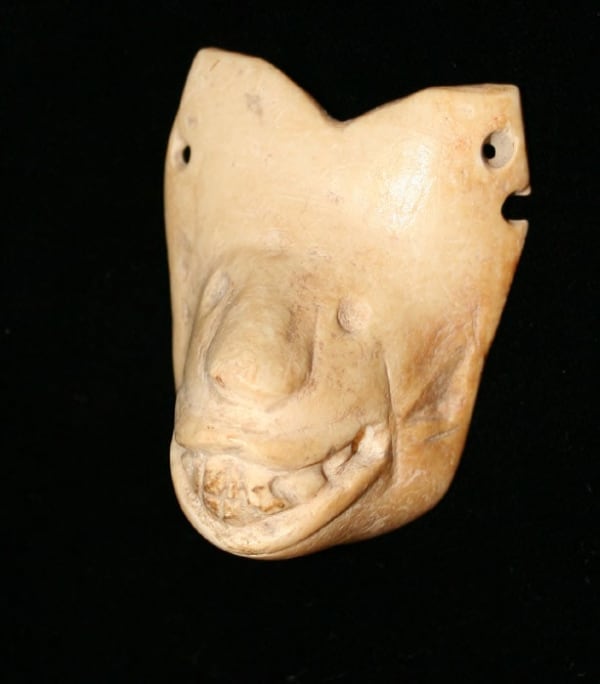 Colima Shell Pendant Depicting the Head of a Dog